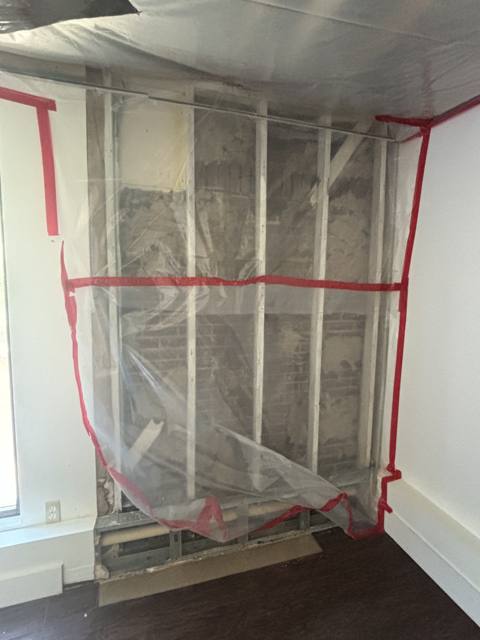 Drywall repair with dust containment plastic up