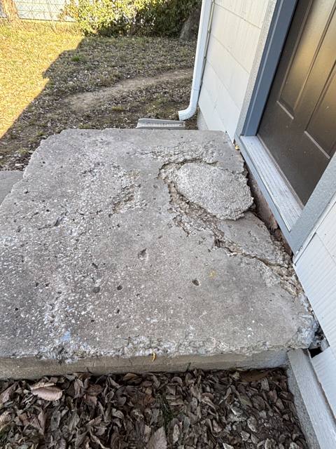 Front steps before: crumbling concrete stoop
