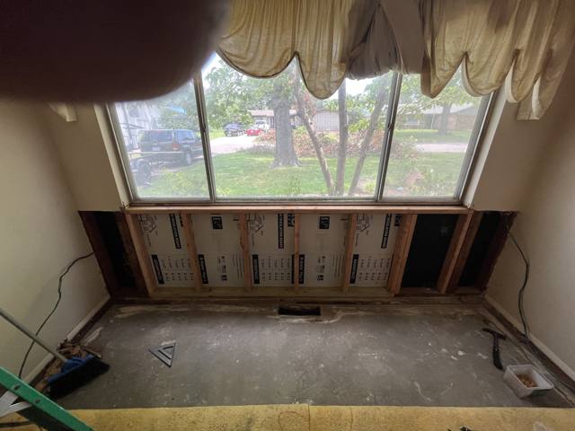 Window wall during: framing prepped for insulation