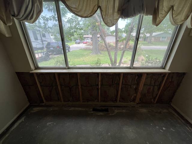 Window wall during: new insulation in the open wall