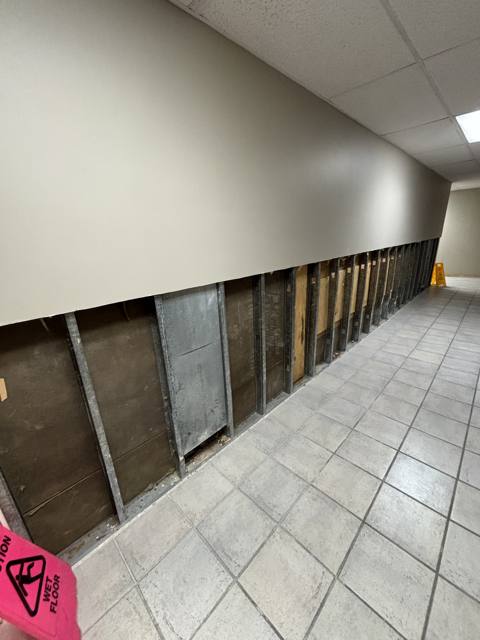Commercial hallway during: wall rebuilt along the corridor