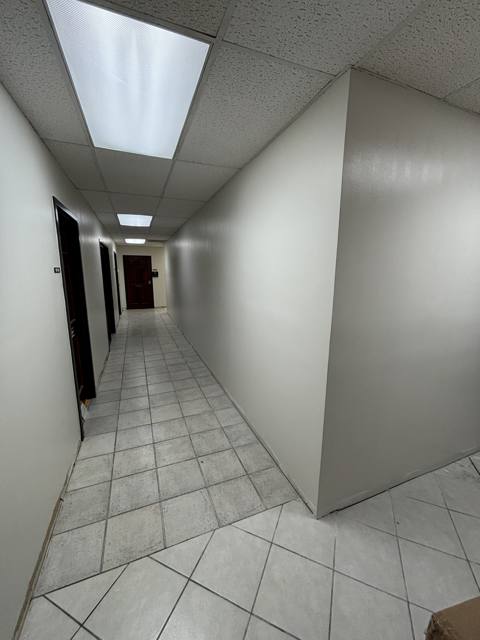 Commercial hallway after: walls finished and painted